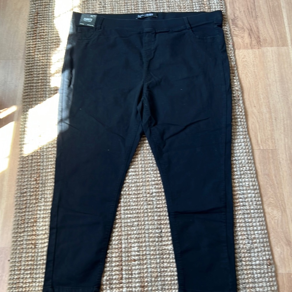 Black, stretch denim pants, size 28.